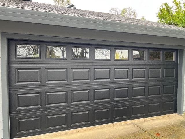 Garage door repair in Atlanta — black sectional garage door serviced by Garage Door Max